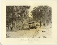 The road into Arltunga, with a Bond's Tour bus, 1946