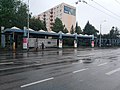 A different part at the bus stop with pyramidal roofs