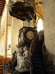 Pulpito, collegiata di Santa Gertrude, Nivelles; il gruppo scultoreo rappresenta Cristo e Samaritana e i medaglioni rappresentano le parabole del Seminatore, del Figliol prodigo e del Padre misericordioso