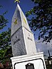 A stone pylon with two gold stars at the sides, below which are inscribed "A Jose Rizal"
