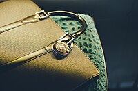 Clip-on purse hook that doubles as jewelry for your handbag.