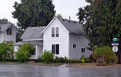 Photograph of a house on a street corner.