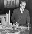 Image 18Robert Moses with a model of his proposed Battery Bridge, never built (from History of New York City (1898–1945))