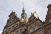 A sculpture on the façade of the English House (left) in Gdańsk was reconstructed by the artist at the beginning of the 1980s