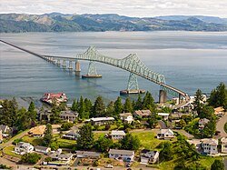 City of Astoria, Oregon in the foreground with the Astoria–Megler Bridge spanning the Columbia River to Washington State