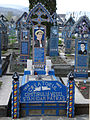 The tombstone of Stan Ioan Pătraş (1908–1977), the creator of Merry Cemetery