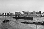 IWM caption : HMS UNRUFFLED returning to harbour in Malta after a patrol in the Mediterranean where she supported the Allied victories in North Africa, Sicily and Italy. During the campaigns, the Ship's Company were awarded a DSO and bar, three DSCs, eleven DSMs and were Mentioned in Despatches on six occasions. Success on her "Jolly Roger"indicates the sinking of 12 supply ships totalling 40,000 tons, three supply schooners, the disabling of an Italian cruiser disabled and a train shot up.