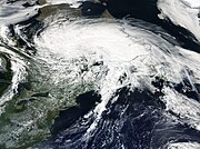 A satellite image of a large non-tropical cyclone over Eastern Canada with cyclonically organized clouds