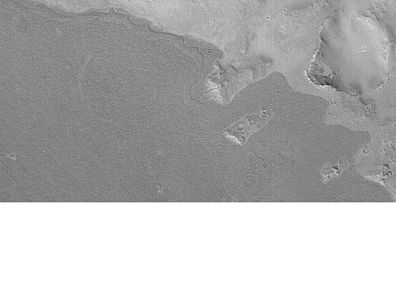 Lava flow in Elysium. There are many lava flows in the Elysium quadrangle. In this one, the lava flowed toward the upper right. Image taken by Mars Global Surveyor, under the MOC Public Targeting Program.