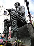 Statue in Odense being led out to the harbour during a public exhibition