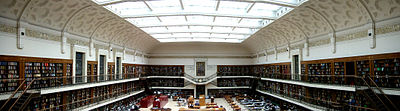 Panoramic photograph of a book-lined room