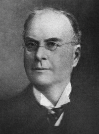 A black and white photographic portrait of Thayer Melvin in his later years.