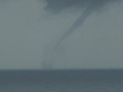 A small waterspout that's pratically invisible seen in this photo.