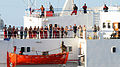 Image 57The crew of the merchant vessel Faina stand on the deck after a U.S. Navy request to check on their health and welfare. The Belize-flagged cargo ship owned and operated by Kaalbye Shipping, Ukraine, was seized by pirates 25 September 2008 and forced to proceed to anchorage off the Somali Coast. The ship is carrying a cargo of Ukrainian T-72 tanks and related military equipment. (from Piracy off the coast of Somalia)