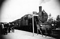 NS 6005 with a train along the platform of Valkenburg station. (03-07-1947)