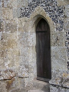 A sundial beside a priests’ door