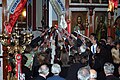 People receiving the holy light from Father Diogenis, minutes before midnight. (2007)