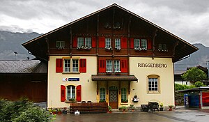 Three-story building with gabled roof