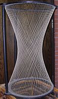 A hyperboloid of one sheet is a doubly ruled surface: it can be generated by either of two families of straight lines.