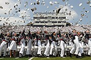 West Point cadets toss their hats.