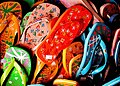 A variety of colourful flip flops.