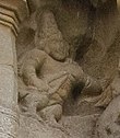 sculpture of a kinnara playing a yazh (harp)