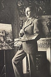 Marcel Catelein dans son atelier. En arrière plan, copie du tableau Rouget de Lisle chantant la Marseillaise