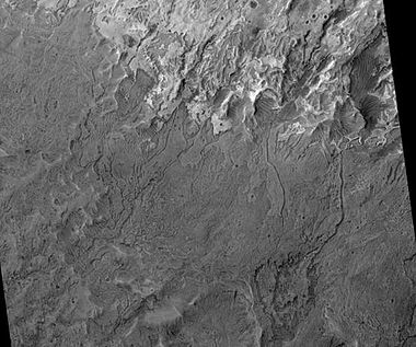 Melas Chasma Fluvial Channels, as seen by HiRISE. Click on image to see meandering and branching channels made with running water in the past.