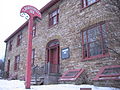 The foreground section was built of rubble stone around 1830.