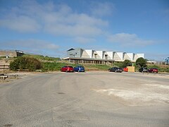 Car park with old gun emplacement visible to left