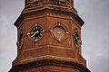 The building's steeple is adorned with clocks