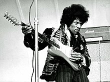 Black-and-white picture of Jimi Hendrix standing