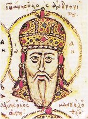 Head of an elderly white-bearded man, wearing a golden jewel-encrusted domed crown and surrounded by a halo.
