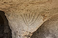 Menorah sculpté dans la Grotta del Carciofo