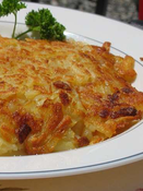 Photo d'un plat de roesti (galette de pommes de terre râpées), spécialité suisse.