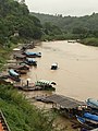 Boats crossing the border from Thailand (left) to Myanmar (right) across the Ruak River