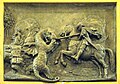 Close-up of the bronze relief featuring St. George and the dragon.
