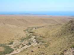 Looking toward Chok-Tal (on the peninsula) and Tamchy airport (to the right of it) from the plain above Tamchy