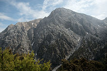 Tourists walking through a gorge