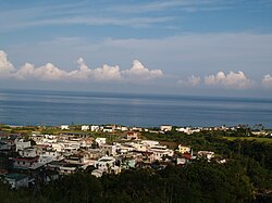 Ningpu Village, with the Pacific Ocean in the background