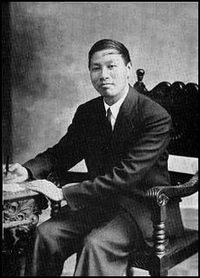 Watchman Nee seated in front of a desk