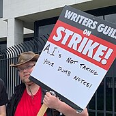 WGA picket sign against AI replacement