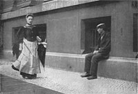 Pimp waiting for a prostitute after her medical check, Berlin, 1890