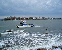 City Island as seen from Orchard Beach in the winter of 2007; there is an abandoned boat in the foreground