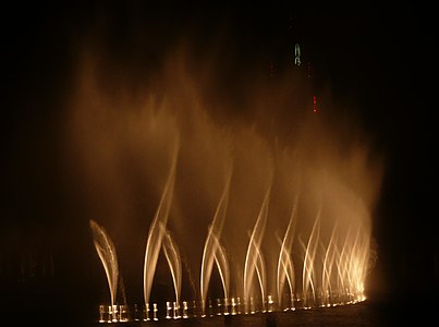 Dubai Fountain (2008), a computer-programmed musical fountain, is 250 m (820 ft) long and can jet water 150 m (490 ft) into the air