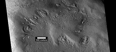 Wide view of dipping layers, as seen by HiRISE under HiWish program