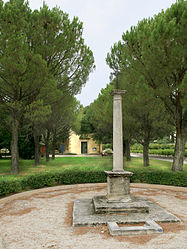 Column with a cross at the centre of the village