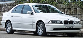 A white BMW E39 525i sedan