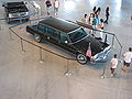 Regans Limo at his Museum with Suburban car behind it.