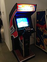 An arcade cabinet with handlebars